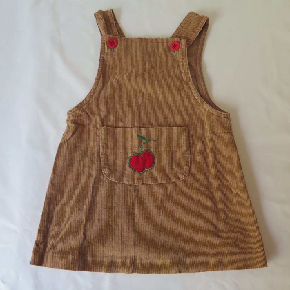 Vintage baby girl's dress with apple